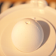 Slightly cracked egg sitting on the base of the Eggstractor